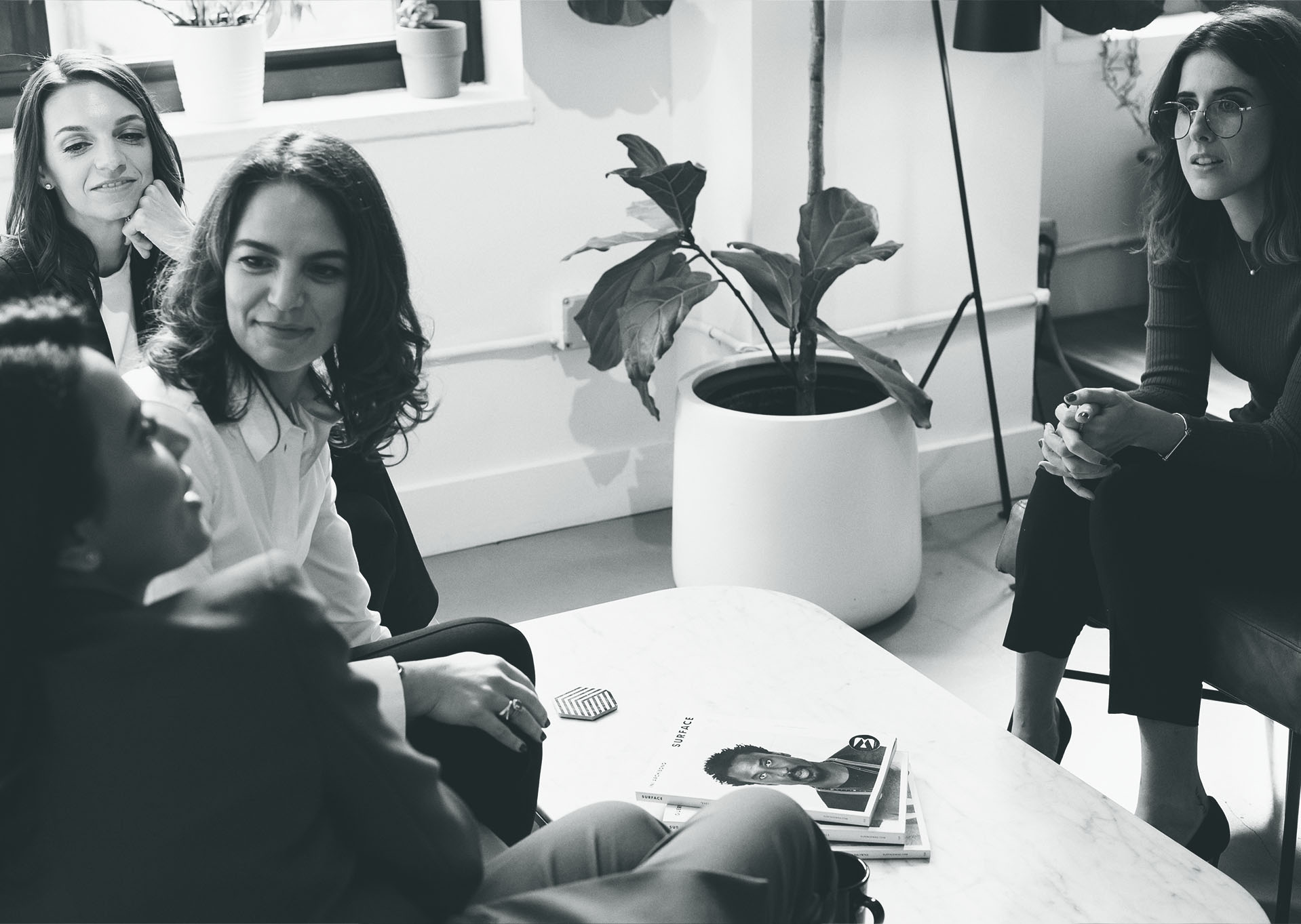 Members of the Heilbut LLP team sitting in a conference room in conversation.